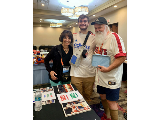 Pam Litz & Randy Parsons welcome a visitor from a local pin store